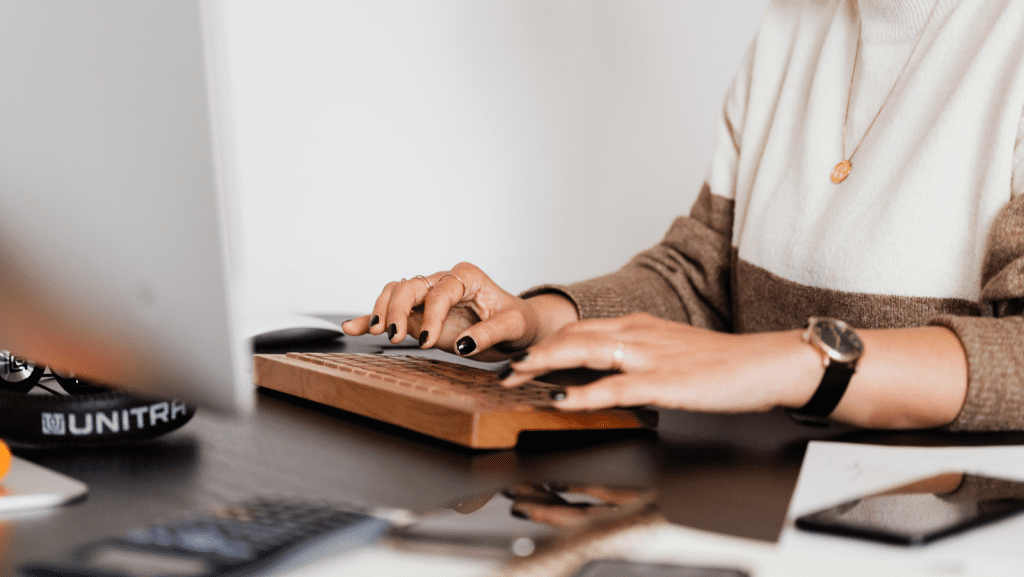 Woman tying on a wooden style keyboard