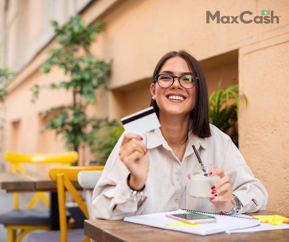 woman happy holding credit card