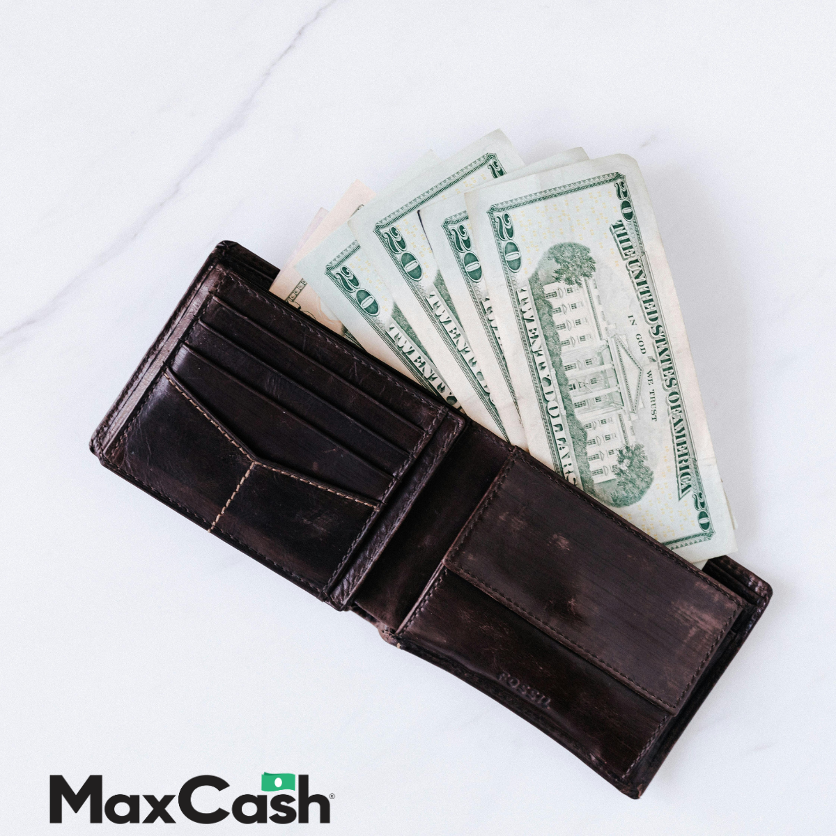 Money sitting in a wallet on the counter